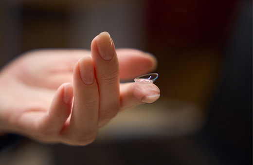 contact lens on tip of a finger